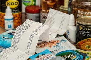 grocery receipt with groceries in the background